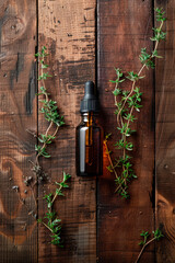 thyme essential oil in a bottle. selective focus.