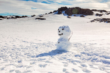 Snowman, Vatnajokull National Park, Iceland, on a fine spring day. Focus on snowman.