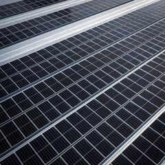 Solar panels on a roof of a large industrial or warehouse building, aerial view form top.