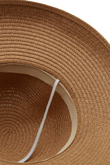 Close-up shot of a beige straw broad-brim sun hat. The casual straw hat with a wide brim is isolated on a white background. Cropped bottom view.