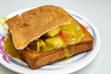 Curry coffin bread is a famous snack of Tainan in Taiwan. 