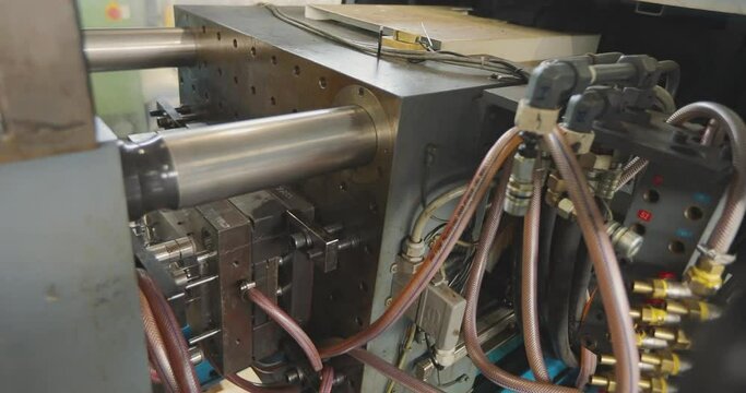 Injection molding thermoplastic machine. The process of creating a plastic part by injection molding