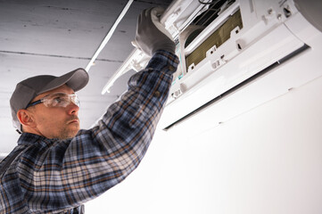 Heating and Cooling Technician Performing Repair