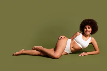 Fotobehang No filter photo of carefree shiny lady underwear lingerie loving body positive empty space isolated khaki color background © deagreez