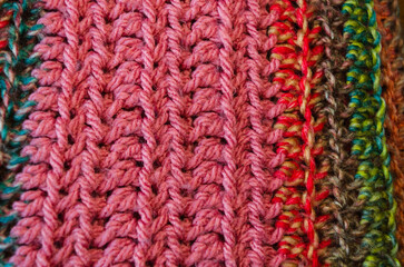 Close-up of a multi-coloured hand knit crocheted blanket