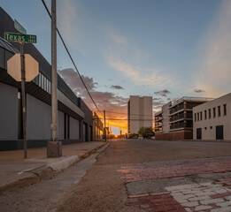 Sun setting on an old brick street in downtown, Lubbock, Texas, United States
