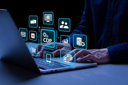 Customer Data Platform (CDP) concept. Businessman working on laptop with CDP icons. Data planning for customer database mangement and accessible to other systems. Online Marketing.