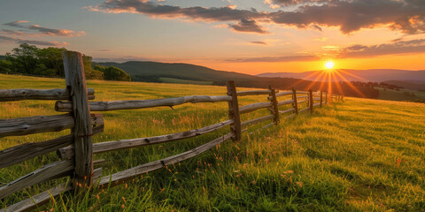 Golden Sunrise Over Rustic Wooden Fence in Pastoral Landscape