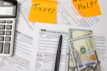Tax time concept. Tax form with office supplies on white. financial document.