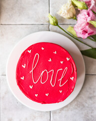 Bento cake with inscription Love and hearts. Small Korean style cake for one person. A cute dessert gift for any occasion for a loved one.