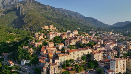Aerial view of Corte old town, Corsica island. Morning shot of old houses on the hill in Corte village, Corsica, France - 780557852