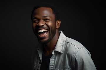 young black african middle aged man on plain bright black background laughing hysterically looking at camera background banner template ad marketing concept from Generative AI