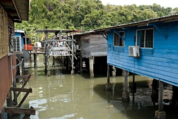 Fototapeta na wymiar View of dwellings in Sim Sim water village Sandakan and Sulu Sea. Sabah. Borneo island. Malaysia. Asia.