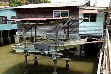 Fototapeta na wymiar View of dwellings in Sim Sim water village Sandakan and Sulu Sea. Sabah. Borneo island. Malaysia. Asia.