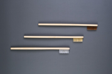 Three Wooden Combs on Gray Surface.Health Care, Stomatology banner 