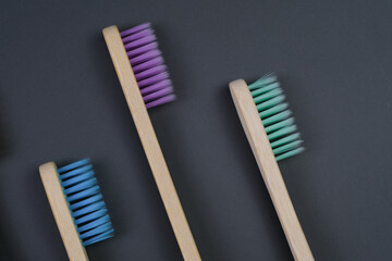  Toothbrushes on a grey backgorund. Eco-friendly toothbrushes..Health Care, Stomatology banner 