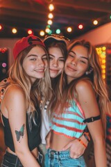 Lesbian girls friends hugging and having fun at a night party