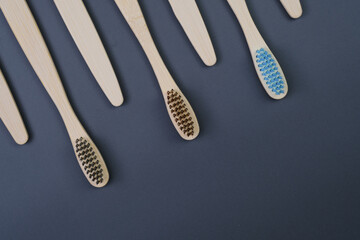 Toothbrushes on a grey backgorund. Eco-friendly toothbrushes..Health Care, Stomatology banner 