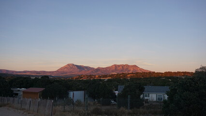 The Spanish Peaks During Golden Hour With Trees and No Clouds