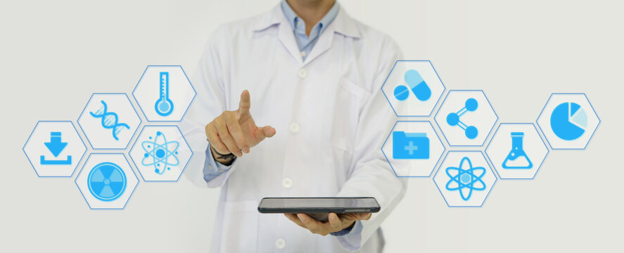 A doctor in a white lab coat holding tablet computer, pointing finger toward with his hand showing symbol of medicine innovation, treatment, discovery and healthcare analysis.