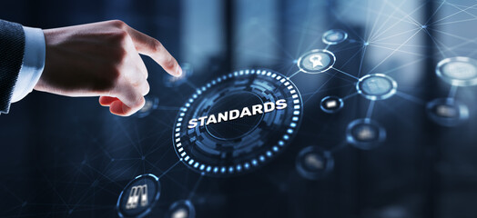 Businessman clicks Standards Quality assurance and control concept - 780583425