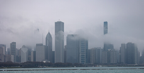 Fototapeta na wymiar Chicago skyline as seen from Michigan lake during foggy, rainy afternoon