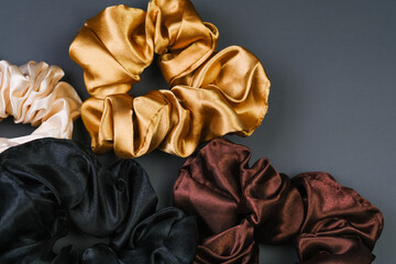 Three Colorful Scrunchies on Gray Background