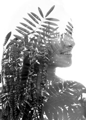 A double exposure female portrait disappearing into background - 780591633