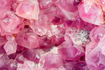 pink amethyst gem crystals background, top view
