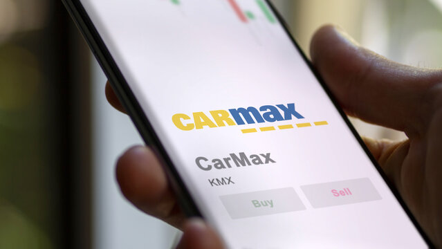 April 09th 2024 , Richmond, Virginia. Close up on logo of CarMax on the screen of an exchange. CarMax price stocks, $KMX on a device.