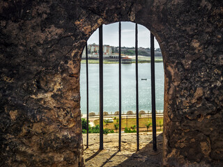 the facade of an old building with windows and doors. Fort Jesus is Portuguese fortification in Mombasa, Kenya. It was built in 1593