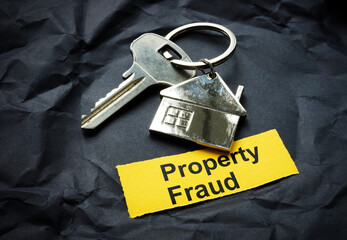 Key and strip with inscription property fraud.