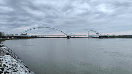 panoramic view of the bridge over Danube river in Novi sad, reflected in the water surface 