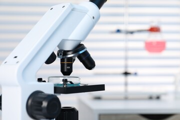 Laboratory analysis. Modern medical microscope indoors, closeup. Space for text