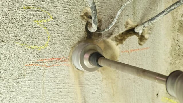 rotary hammer and diamond core drill to create socket holes in wall crowning on concrete for the socket