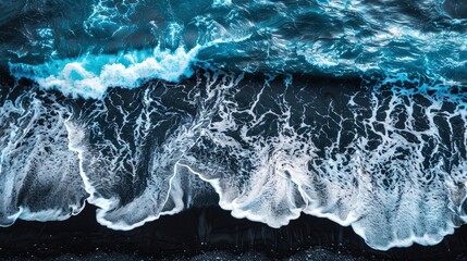 An aerial view of the ocean waves crashing against rocks, top down view, birds eye perspective, beach scene in the style of M energetic, black sand on an island in Iceland