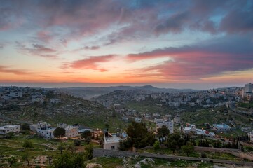 Sunrise in Palestine, a peaceful landscape at dawn. night lights in old historical biblical city...