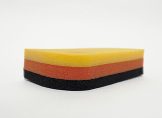 A triple layered scrubbing sponge.