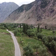 road in the mountains Walkway Footpath River Flowing Water Mountain Road Bend Cobblestone Grass Natural Plants Travel Climbing Mountain Cloud Blue Sky
