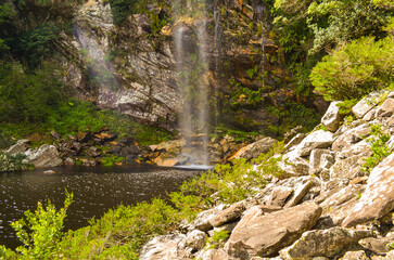 Beautiful and tall waterfall sliding down the rock wall in Serra do Cipó in Minas Gerais, Brazil