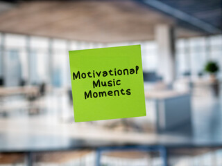 Post note on glass with 'Motivational Music Moments'.