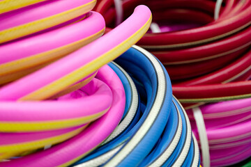 Rolled up colorful garden hose