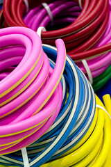 Rolled up colorful garden hose