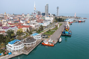 Aerial view of Batumi seaside promenade and diverse urban landscape captured by drone. 