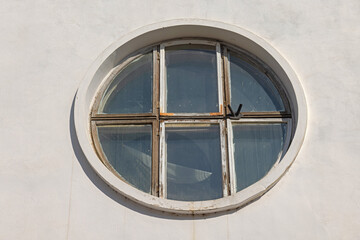Big Round Window at White Wall Old House