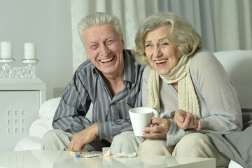Portrait of elderly man and woman with flu