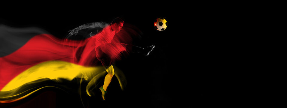 Concentrated and competitive man, football player in motion during game on black background with flag of Germany element. Concept of professional sport, competition, tournament. Banner. Sport event - Powered by Adobe
