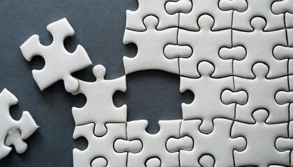 Empty white jigsaw puzzle with missing pieces