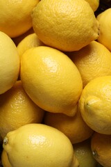 Many fresh lemons as background, top view