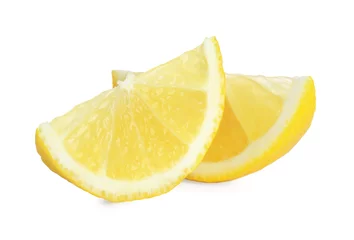 Deurstickers Pieces of fresh lemon isolated on white © New Africa